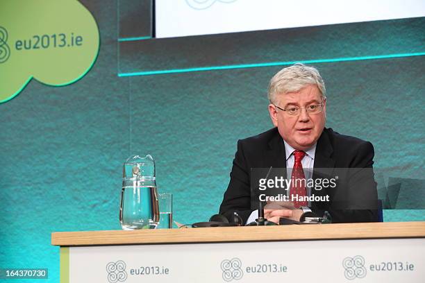 In this handout image provided by The Department of the Taoiseach, Eamon Gilmore TD, Tánaiste and Minister for Foreign Affairs and Trade, attends a...