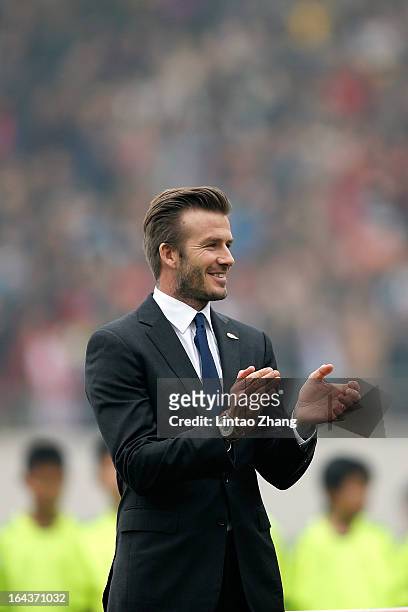 British football player David Beckham attends a meeting with the Youth Football Team at Hankou Literary and Sports Center on March 23, 2013 in Wuhan,...