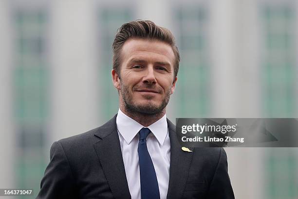 British football player David Beckham attends a meeting with the Youth Football Team at Hankou Literary and Sports Center on March 23, 2013 in Wuhan,...