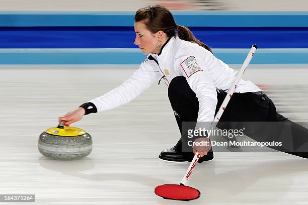 Emma Miskew of Canada throws a stone during the 3rd and 4th Play-Off match between USA and Canada on Day 8 of the Titlis Glacier Mountain World...