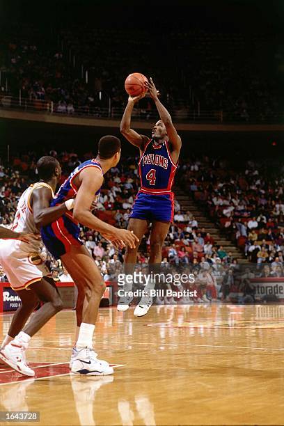 Joe Dumars of the Detroit Pistons shoots a jump shot during the 1990 NBA game against the Houston Rockets at the Summit in Houston, Texas. NOTE TO...