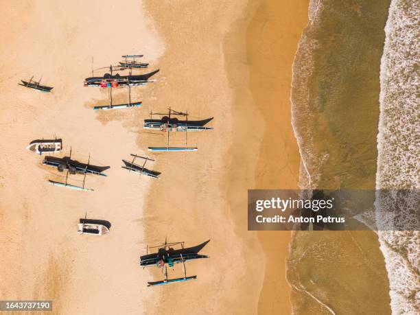 aerial view of the beach with fishing boats. sri lanka - sri lanka stock pictures, royalty-free photos & images