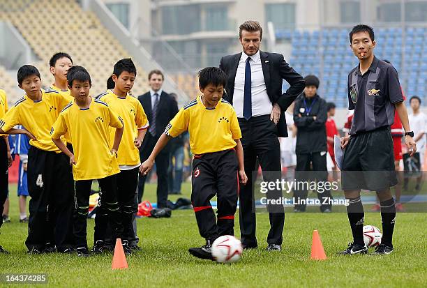 British football player David Beckham attends meeting with the Youth Football Team at Hankou Literary and Sports Centeron March 23, 2013 in Wuhan,...