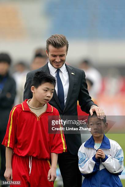British football player David Beckham attends meeting with the Youth Football Team at Hankou Literary and Sports Centeron March 23, 2013 in Wuhan,...