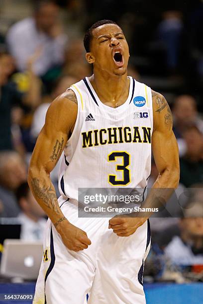 Trey Burke of the Michigan Wolverines reacts in the first half against the Virginia Commonwealth Rams during the third round of the 2013 NCAA Men's...