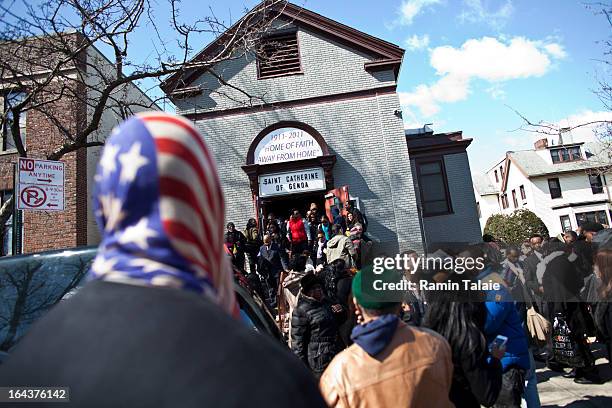 Friends and family of Kimani Gray watch as his casket is carried out after a funeral service on March 23, 2013 in the Brooklyn borough of New York...