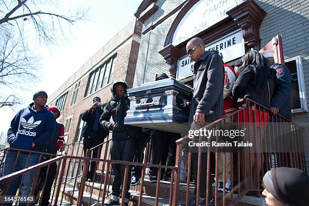 Friends and family of Kimani Gray carry his casket after his funeral service on March 23, 2013 in the Brooklyn borough of New York City. Kimani Gray...