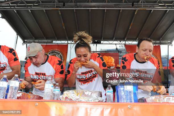 Geoffrey Esper, Miki Sudo and Joey Chestnut take part in the National Chicken Wing Eating Contest on September 3, 2023 at Highmark Stadium, home of...