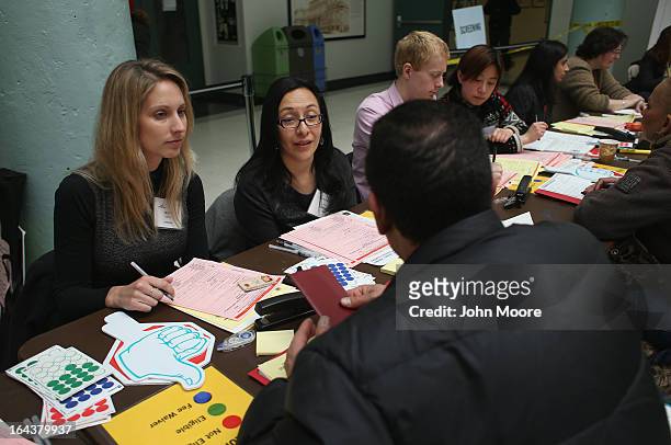 Immigration experts give advice during a Citizenship Application Assistance Day event on March 23, 2013 in New York City. More than 150 legal...