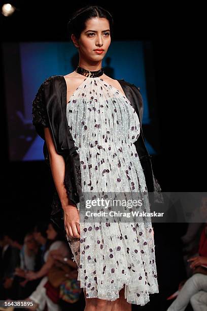 Model showcases designs by Sougat Paul on the runway during day two of the Lakme Fashion Week Summer/Resort 2013 on March 23, 2013 at Grand Hyatt in...