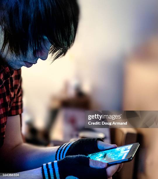 teenage using a smartphone - emo stock pictures, royalty-free photos & images
