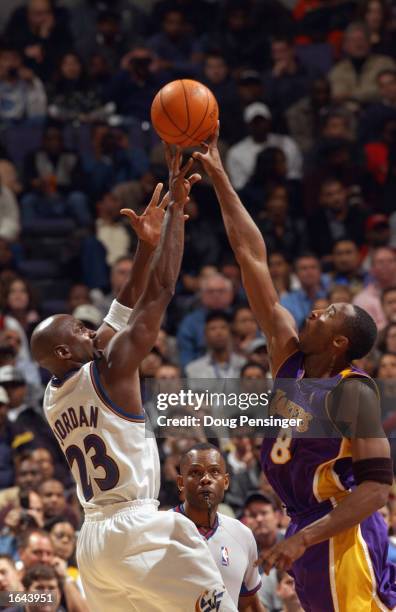 Michael Jordan of the Washington Wizards attempts to shoot the ball over Kobe Bryant of the Los Angeles Lakers during the game at MCI Center on...