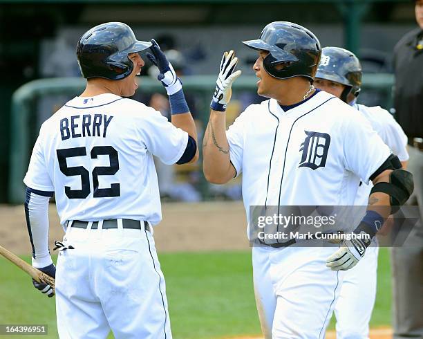 Quintin Berry and Miguel Cabrera of the Detroit Tigers celebrate Cabrera's 7th inning 2-run hiome run against the New York Yankees at Joker Marchant...