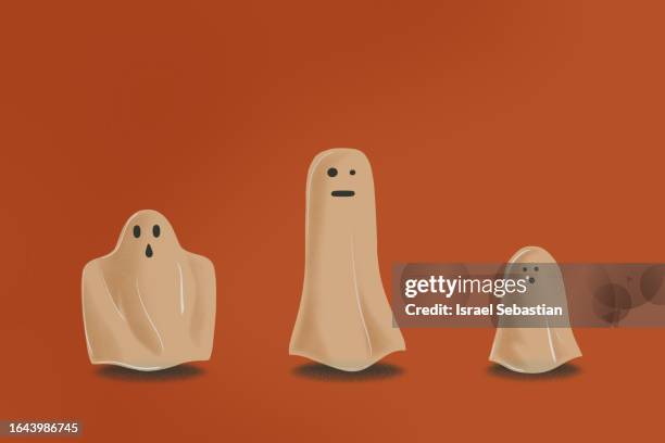 group of cute ghosts lined up on orange background. halloween concept illustration. - fantasma foto e immagini stock