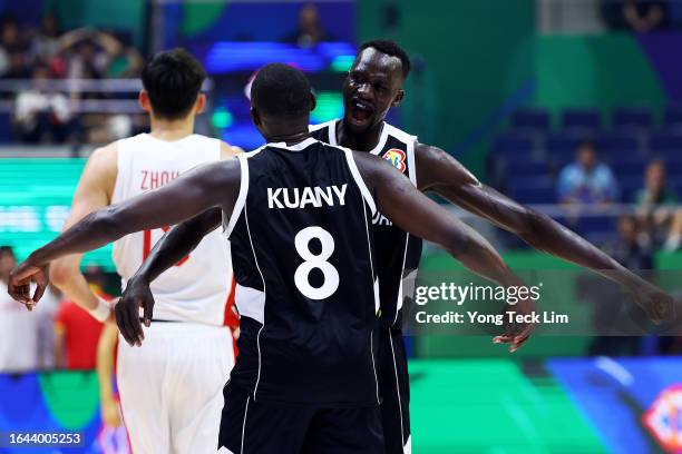 Kuany Ngor Kuany and Majok Deng of South Sudan celebrate after the FIBA Basketball World Cup Group B victory over China at Araneta Coliseum on August...