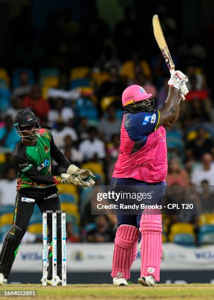 Rahkeem Cornwall of Barbados Royals hits 6 and Andre Fletcher of Saint Kitts and Nevis Patriots during the Men's 2023 Republic Bank Caribbean Premier...