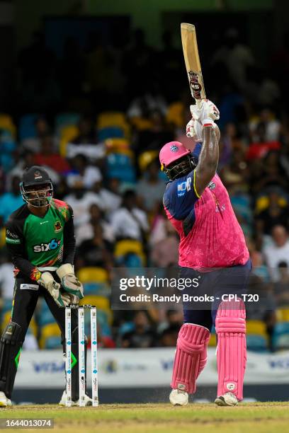 Rahkeem Cornwall of Barbados Royals hits 6 and Andre Fletcher of Saint Kitts and Nevis Patriots during the Men's 2023 Republic Bank Caribbean Premier...