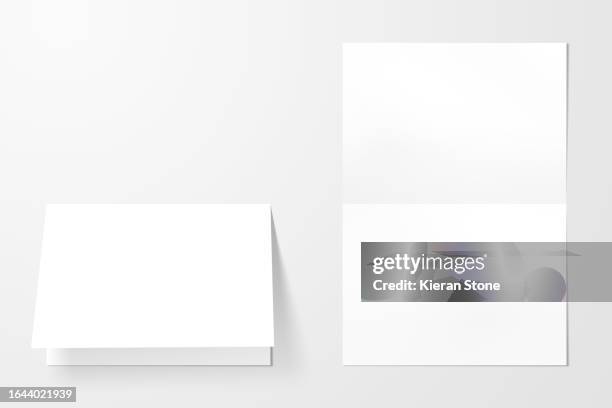 folded blank paper inside and out - fliers stock pictures, royalty-free photos & images