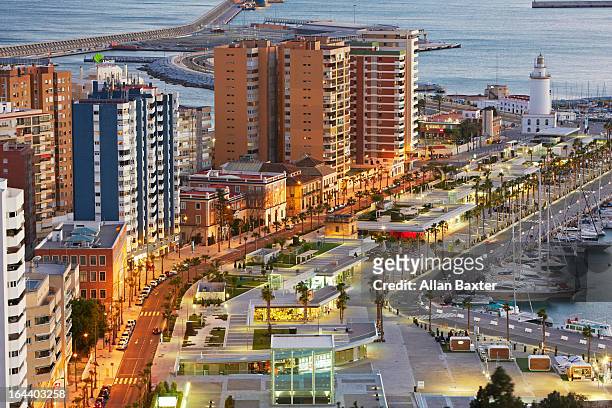 malaga lighthouse and port - malaga province stock pictures, royalty-free photos & images