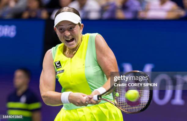 Latvia's Jelena Ostapenko returns the ball to Poland's Iga Swiatek during the US Open tennis tournament women's singles round of 16 match at the USTA...