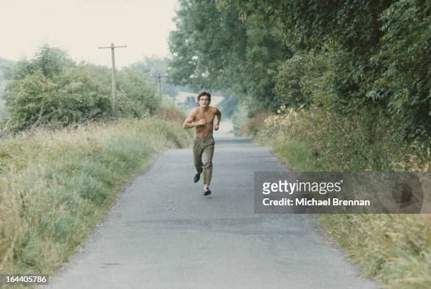 Irish featherweight boxer Barry McGuigan out jogging in the countryside near his hometown of Clones, Ireland, 1984.