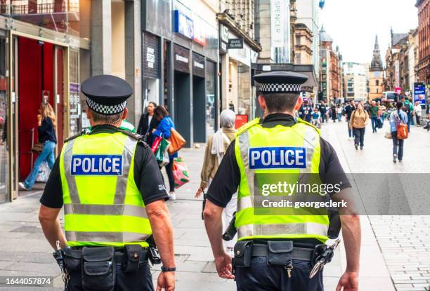 police officers on the street - glasgow stock pictures, royalty-free photos & images