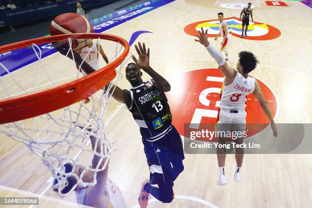 Majok Deng of South Sudan drives to the basket against Zhao Rui of China in the fourth quarter during the FIBA Basketball World Cup Group B game at...