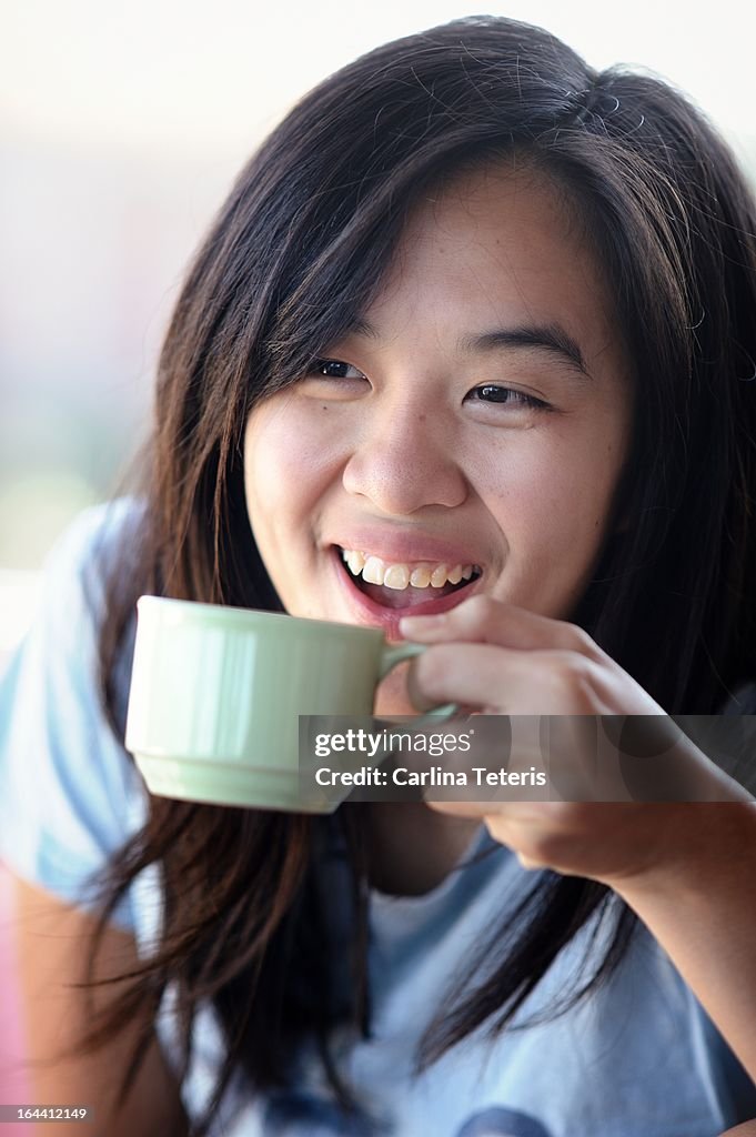 Woman smiling with tea