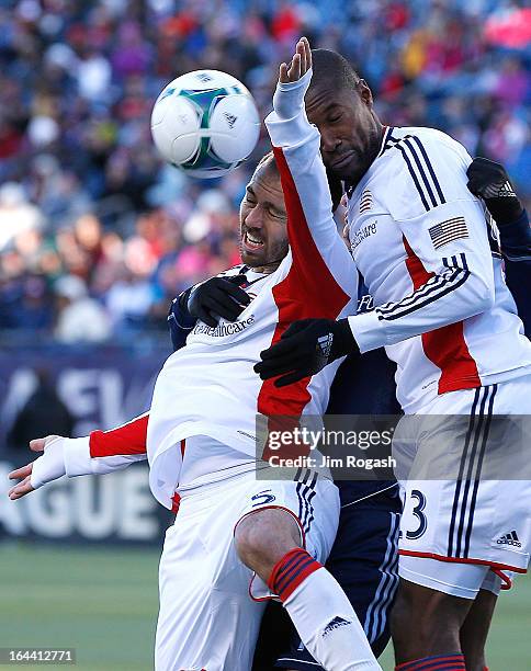 Soares and Jose Goncalves of New England Revolution keep the ball away from their net during a game with Sporting KC in the second half at Gillette...