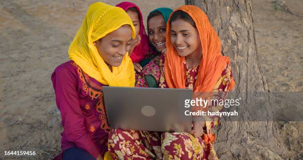 happy indian girls using laptop, india - laptop desert stock pictures, royalty-free photos & images