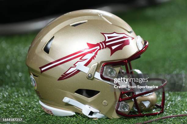 An Florida State Seminoles helmet rests near the sidelines during the Camping World Kickoff game between the LSU Tigers and the Florida State...