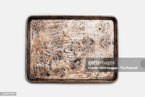 a well used, seasoned baking tray. cookware. baking sheet.  - tablett oder küchenblech stock-fotos und bilder
