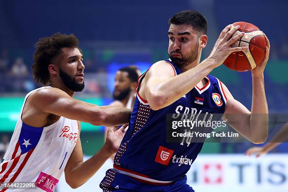 Dusan Ristic Dusan Ristic of Serbia posts up against George Conditt of Puerto Rico ...