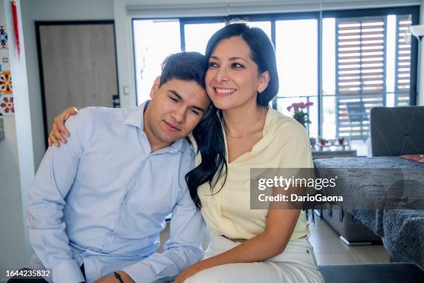 mexican family at home - cuidado stock pictures, royalty-free photos & images