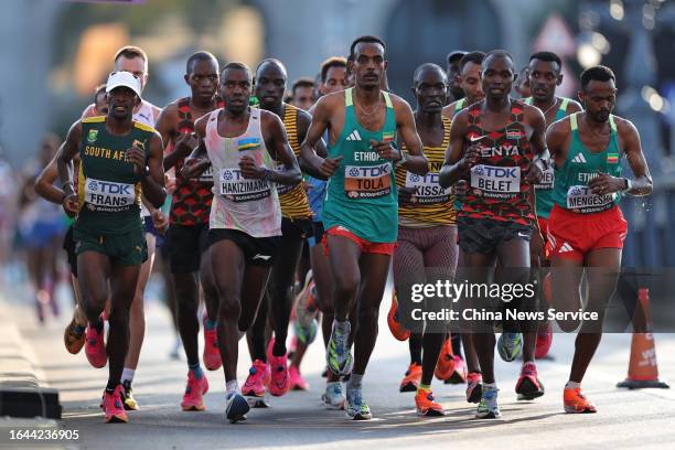 Melikhaya Frans of Team South Africa, John Hakizimana of Team Rwanda, Tamirat Tola of Team Ethiopia, Stephen Kissa of Team Uganda, Joshua Belet of...