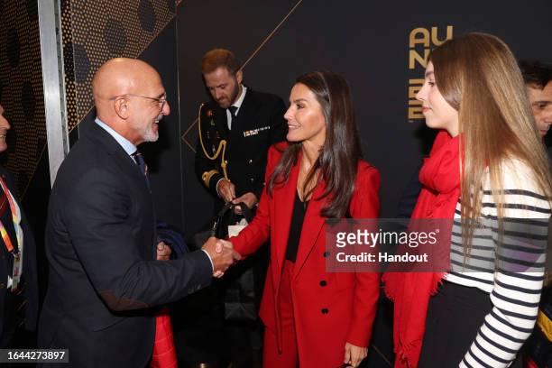 In this handout images released by the Spanish Royal Household, Queen Letizia of Spain and Princess Sofia are greeted by the national coach of the...