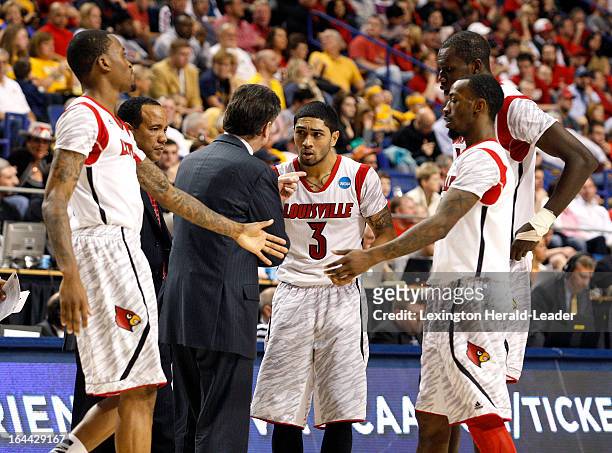 Louisville head coach Rick Pitino talks to Peyton Siva during a timeout in the second half against Colorado State in the third round of the NCAA...