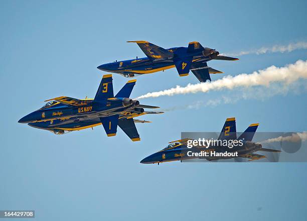 In this photo provided by the Florida Keys News Bureau,the U.S. Navy's Blue Angels perform their precision aerobatics over the Florida Keys during...