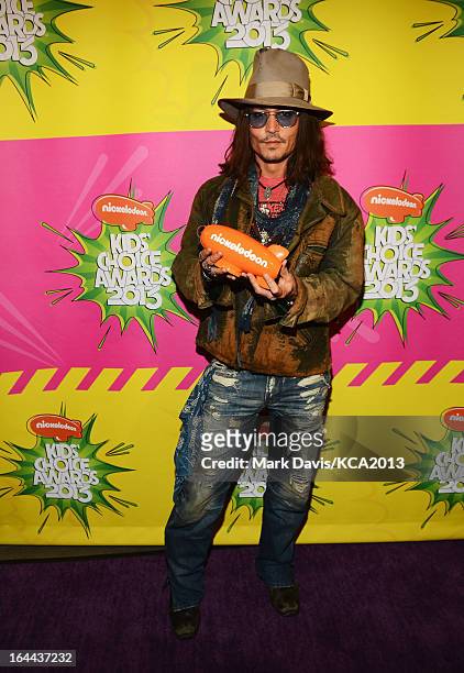 Actor Johnny Depp holds the Kids' Choice Award for Favorite Movie Actor backstage at Nickelodeon's 26th Annual Kids' Choice Awards at USC Galen...