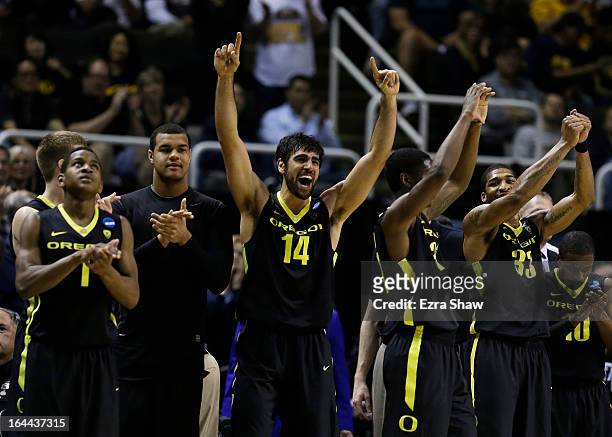 Arsalan Kazemi of the Oregon Ducks and teammates celebrate from the bench during the second half of their 74 to 57 win over the Saint Louis Billikens...