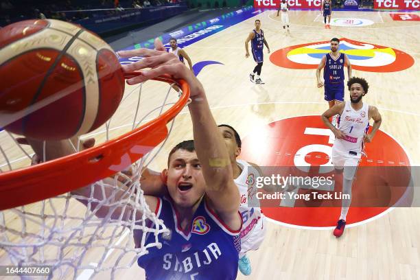 Nikola Jovic of Serbia dunks the ball against Tremont Waters of Puerto Rico in the fourth quarter during the FIBA Basketball World Cup Group B game...