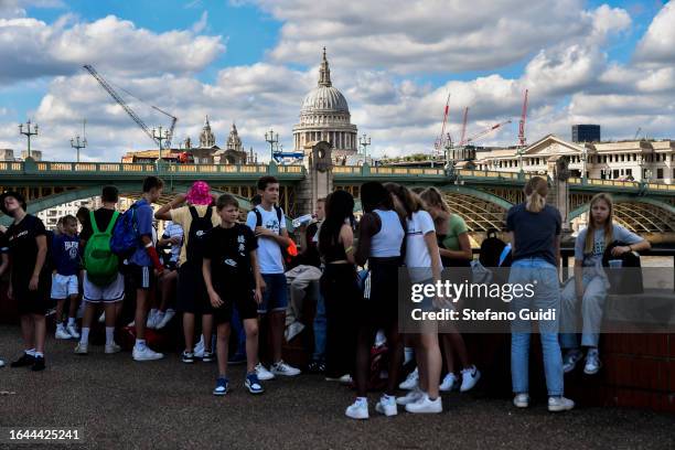 Tourists view St Paul's Cathedral and Southwark Bridge as seen from Bankside on August 21, 2023 in London, England. London is the capital of England,...