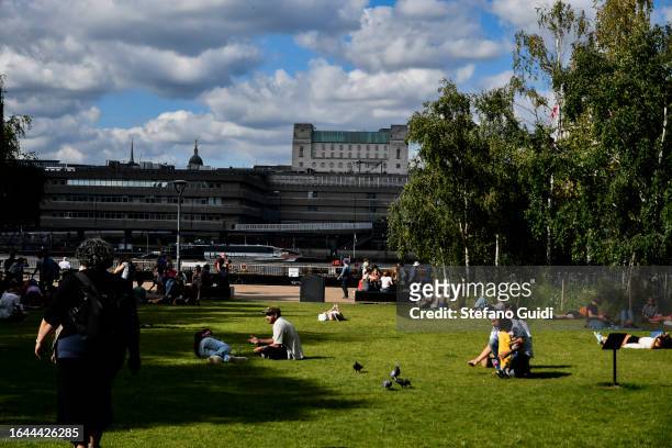 General view of People relax on the Tate Modern Garden on August 21, 2023 in London, England. London is the capital of England, many of the...