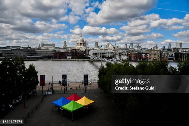 General view of St. Paul's Cathedral and Millennium Bridge seen from a panoramic balcony of the Tate Modern Museum on August 21, 2023 in London,...