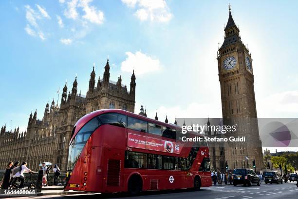 General view of London bus travels over Westminster Bridge with the Palace of Westminster and Big Ben in the background on August 21, 2023 in London,...