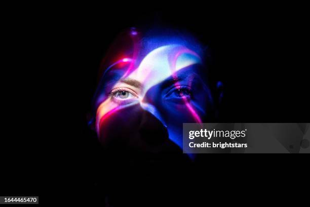 colorful lights on woman's face - futuristic human head stock pictures, royalty-free photos & images