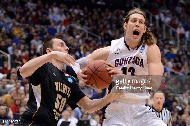 Kelly Olynyk of the Gonzaga Bulldogs with the ball against Jake White of the Wichita State Shockers in the second half during the third round of the...