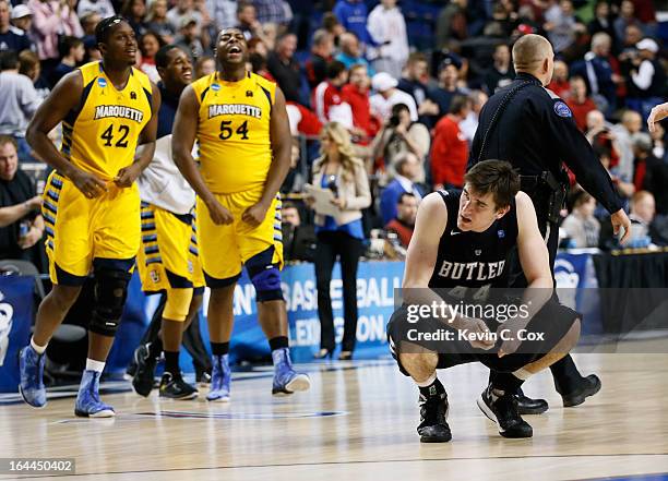 Andrew Smith of the Butler Bulldogs reacts as the Marquette Golden Eagles celebrate after defeating the Bulldogs during the third round of the 2013...