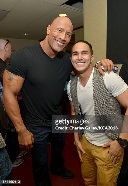 Actors Dwayne 'The Rock' Johnson and actor Carlos Pena pose backstage at Nickelodeon's 26th Annual Kids' Choice Awards at USC Galen Center on March...