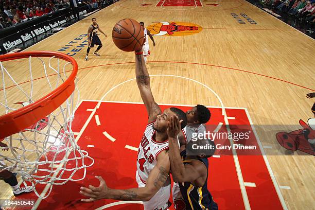 Daequan Cook of the Chicago Bulls goes to the basket during the game against the Indiana Pacers on March 23, 2013 at the United Center in Chicago,...